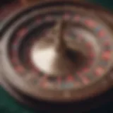 A close-up view of a casino roulette wheel showcasing its intricate design and numbered pockets.